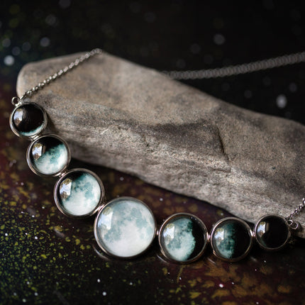Varying Sized Curved Moon Phase Necklace in Silver