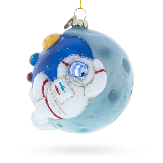 Astronaut Floating in Outer Space Glass Christmas Ornament